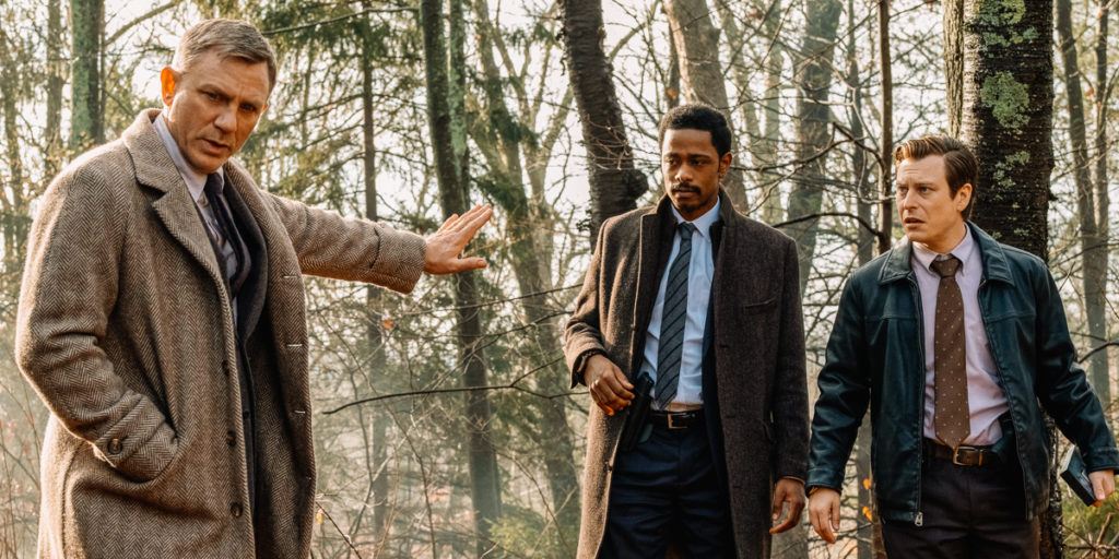 Daniel Craig, LaKeith Sttanfield, and Noah Segan in Rain Johnson's KNIVES OUT. Image courtesy TIFF.